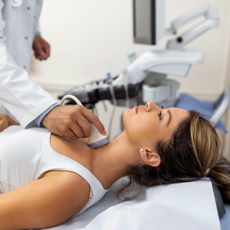 doctor-making-ultrasound-thyroid-gland-woman-patient-clinic-diagnosis-treatment-autoimmune-thyroiditis-concept